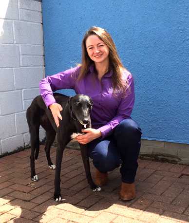 Photo of Jade Brooks and greyhound. Jade is a dog trainer based in Cardiff, Wales, UK.